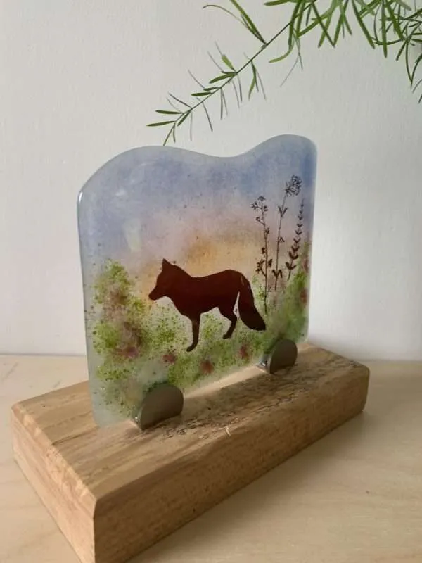 Free standing fused glass autumn fox in wooden base.